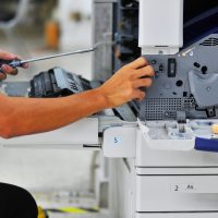 Close,Up,Technician,Repairing,Digital,Photocopier,Machine.